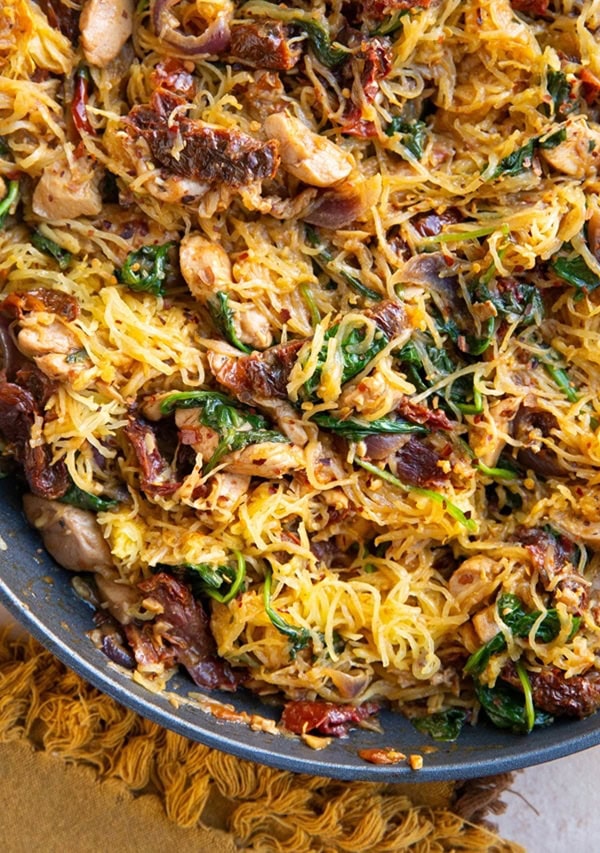 SKILLET OF SPAGHETTI SQUASH WITH CHICKEN, SPINACH, AND SUN-DRIED TOMATOES