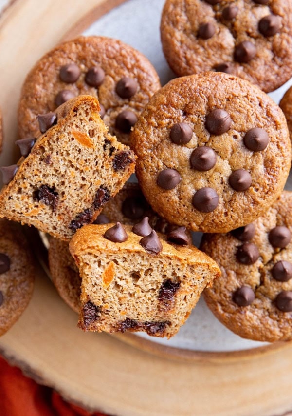 Healthy Sweet Potato Muffins on a plate with one sliced in half