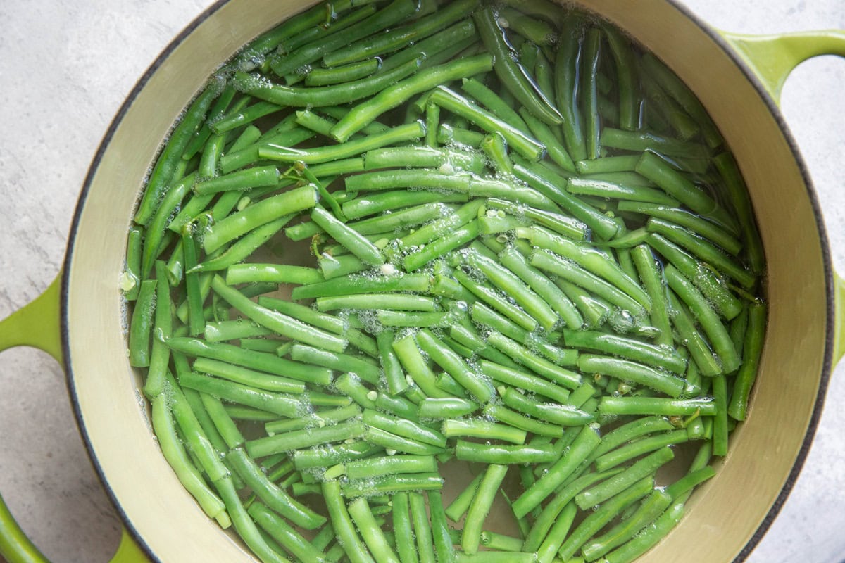 Pot full of water and cut green beans to blanch green beans.