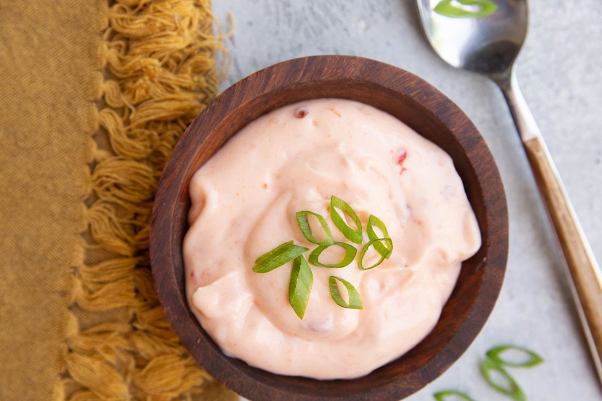 Wooden bowl of bang bang sauce.