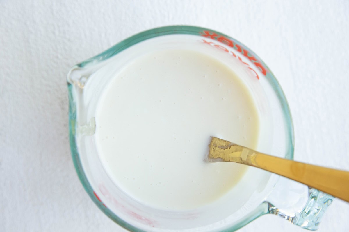 Hawaiian macaroni salad dressing in a measuring cup, mixed up and ready to use.