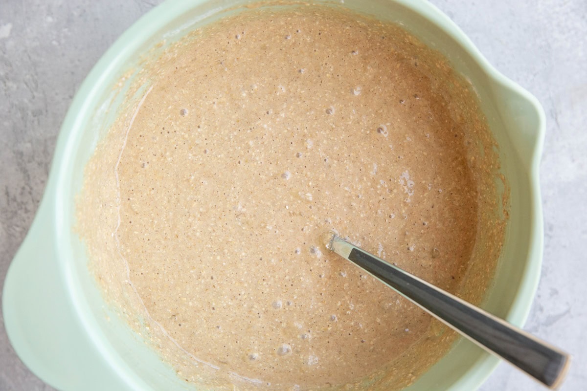 protein banana bread batter in a mixing bowl, ready to be baked.