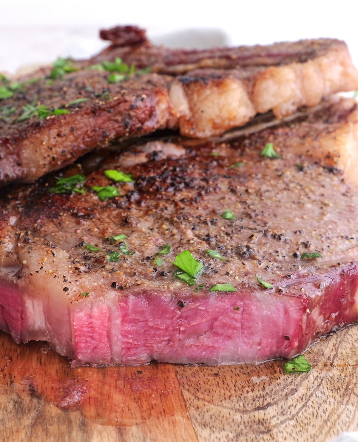 Seared ribeye steak, cut into and ready to eat.