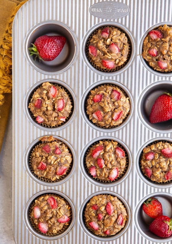 Muffin pan with strawberry oatmeal muffins