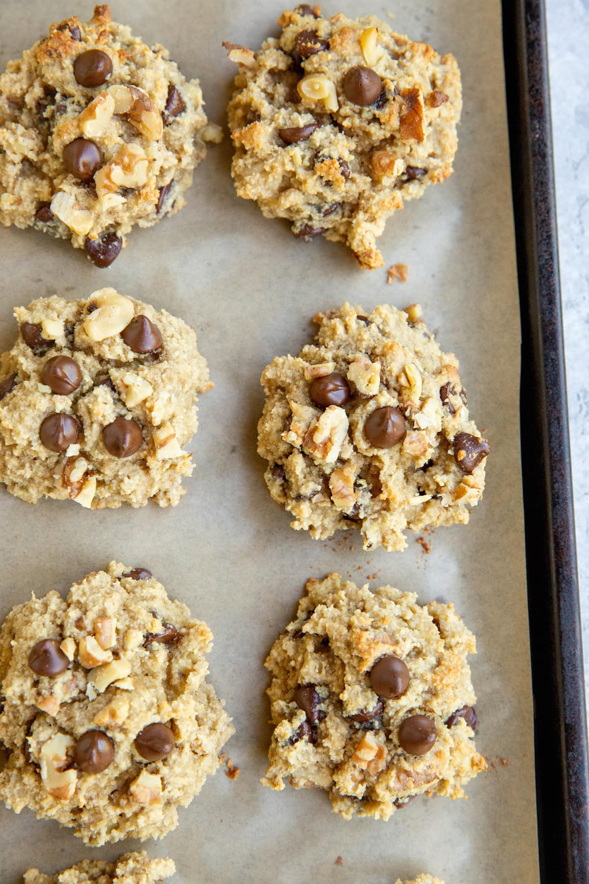 Cookie sheet with banana almond flour cookies.