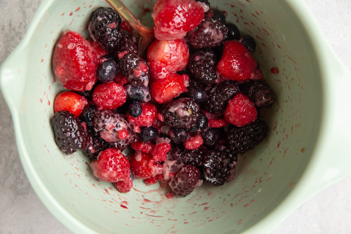 Berry filling ingredients in a mixing bowl all mixed up.