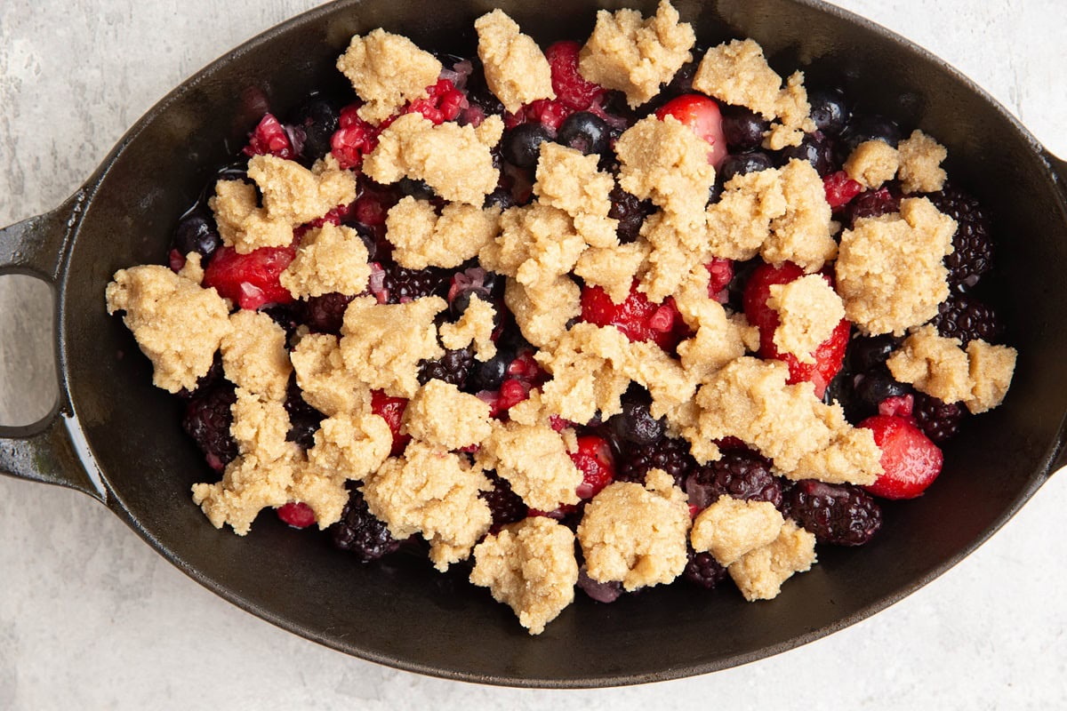 Berry crisp in a baking dish, ready to go into the oven.