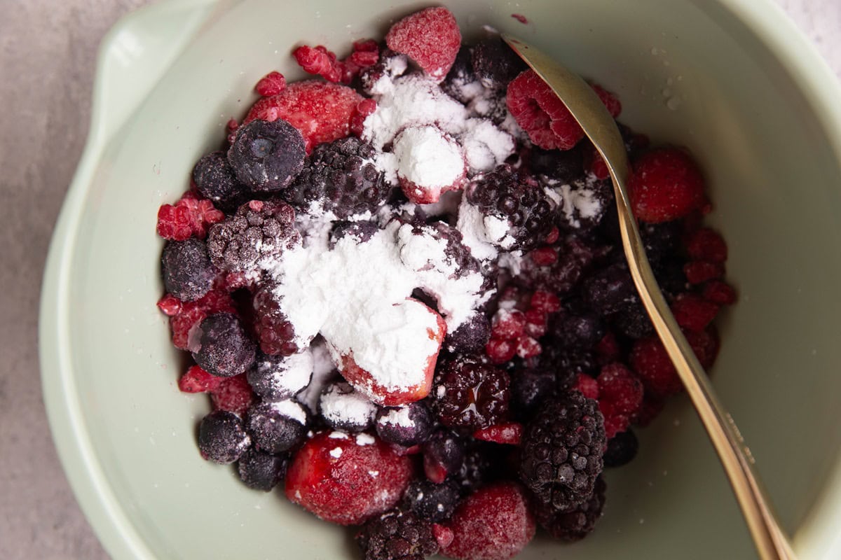 Ingredient for mixed berry filling in a mixing bowl.