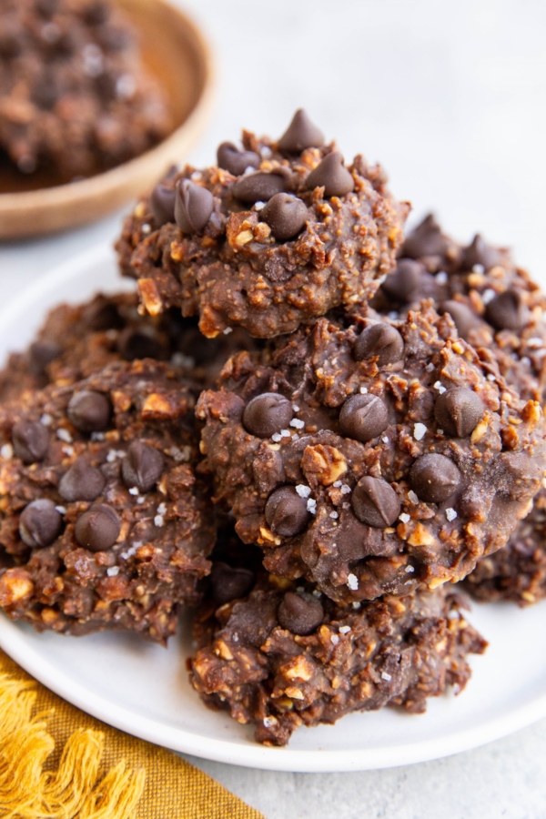 Plate of no-bake cookies with a plate of more cookies in the background, ready to eat.