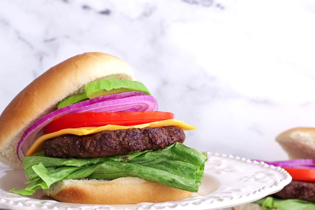 Plate of hamburger with toppings.