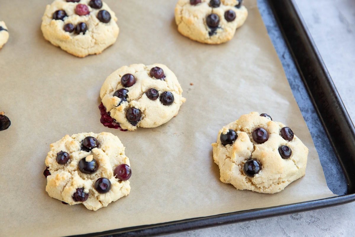 Finished blueberry cookies on a baking sheet.