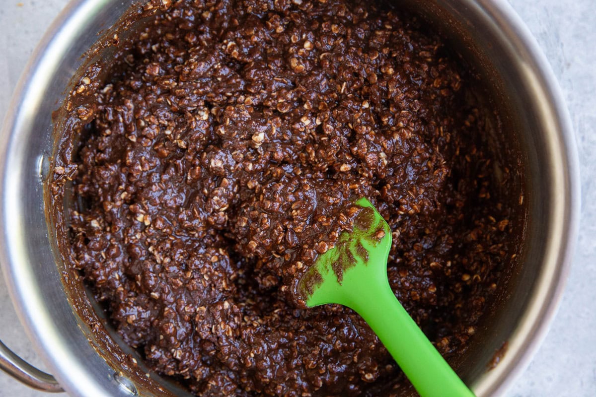 Saucepan of no bake cookie bar mixture all mixed up.