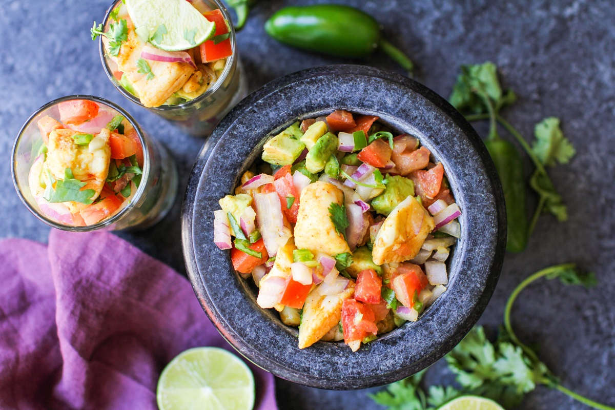 Bowl of ceviche with avocado and tomato