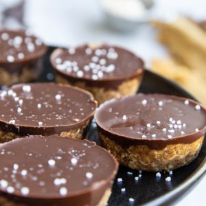 Plate of almond butter cups, ready to eat.