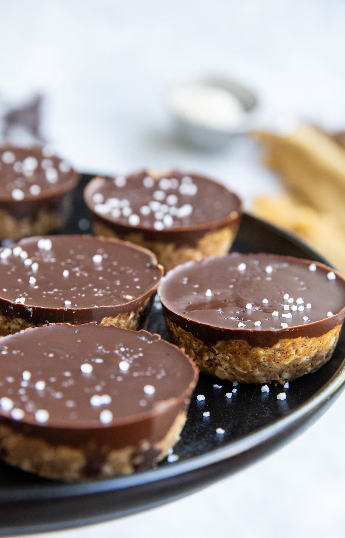 Plate of almond butter cups, ready to eat.