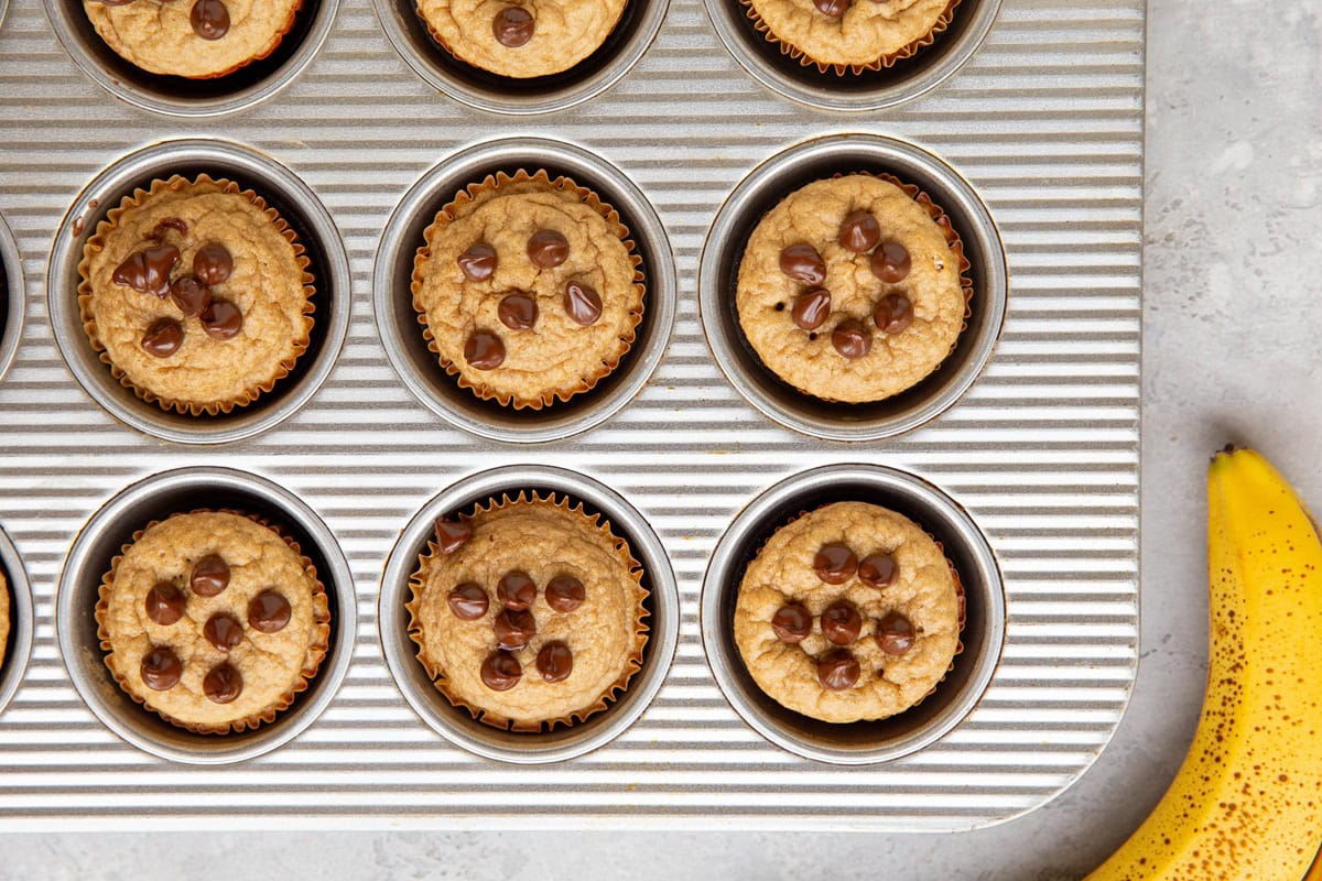 Protein banana muffins in a muffin tray, ready to eat.