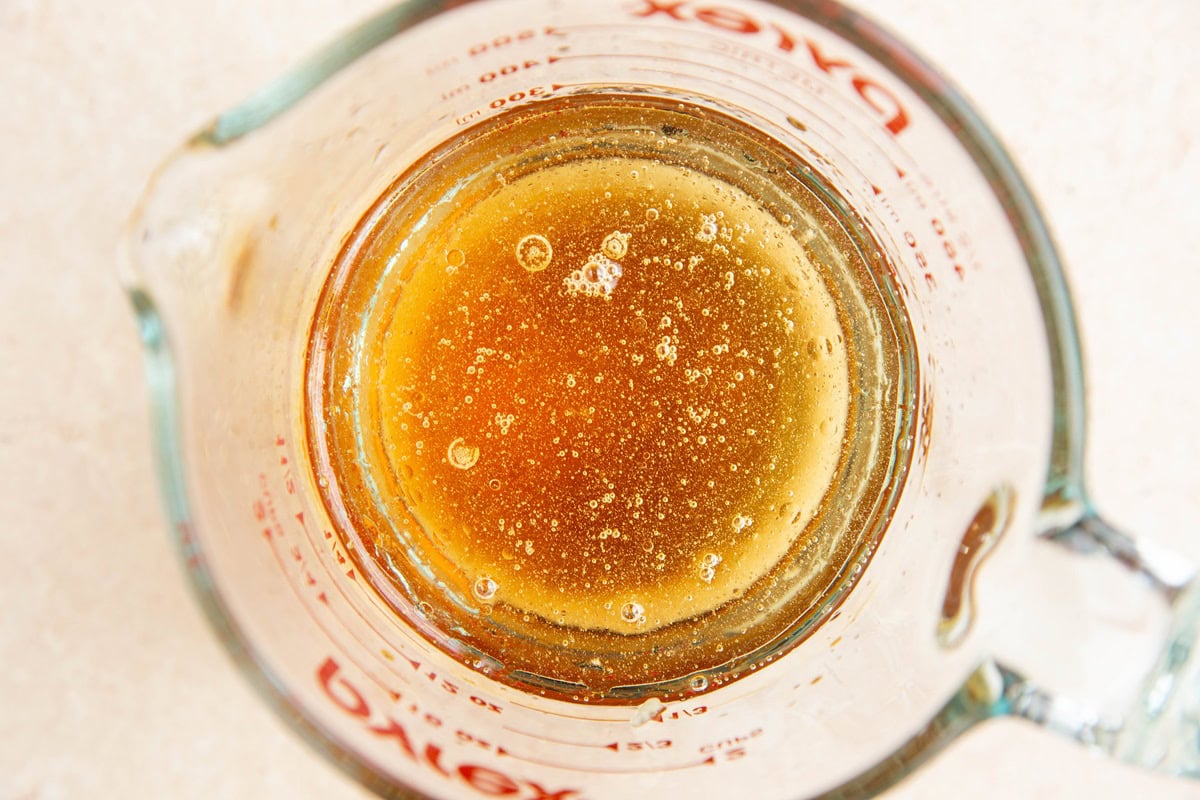 Pickling liquid in a measuring cup.