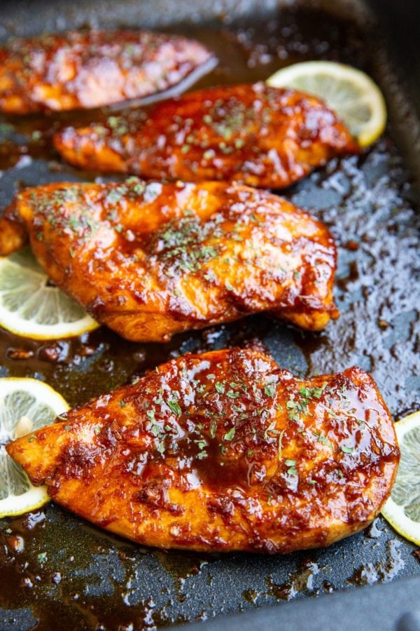 Sesame ginger garlic chicken fresh out of the oven with a delicious looking golden brown glaze.