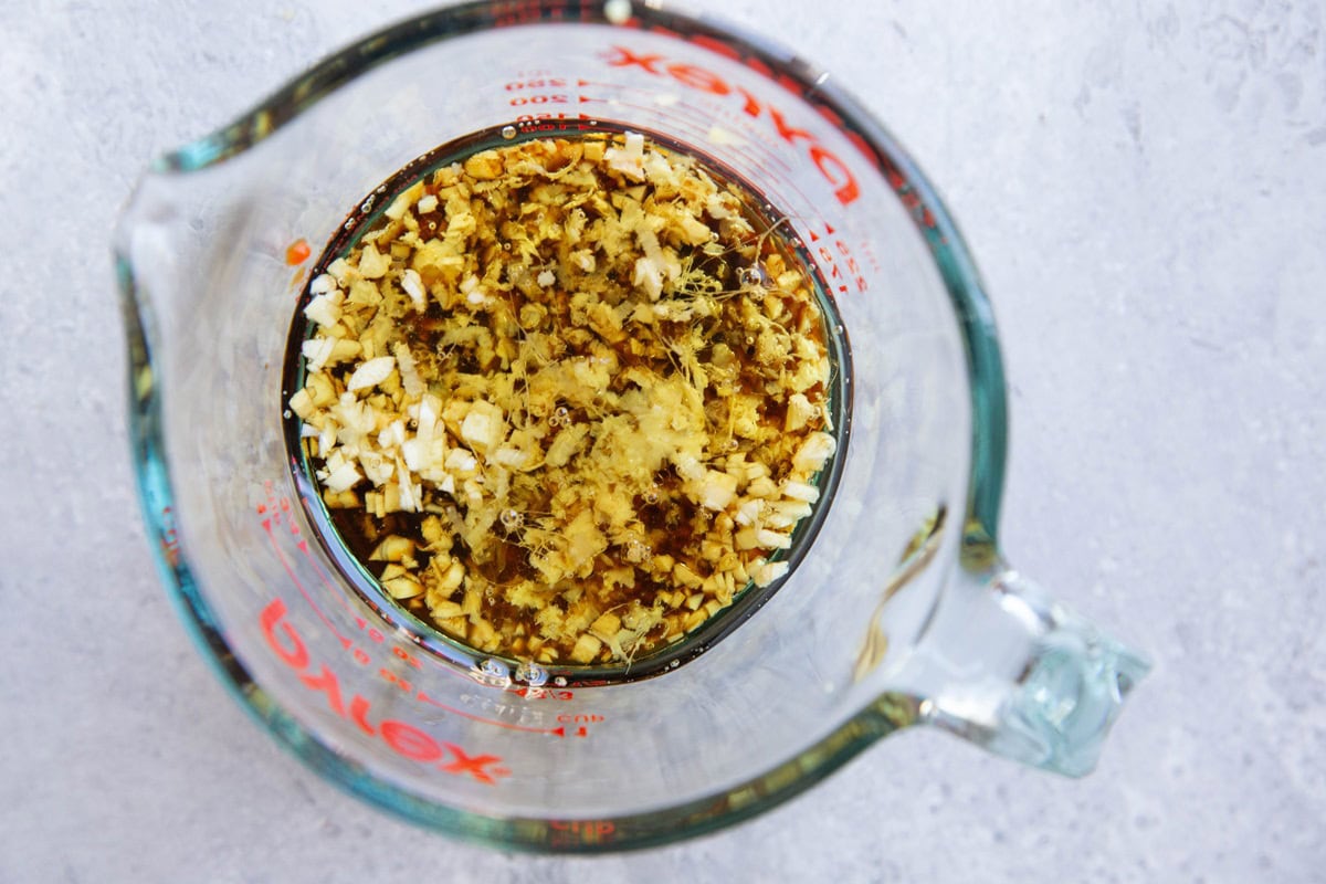 Sesame Garlic Ginger Marinade in a measuring cup, ready to be mixed together