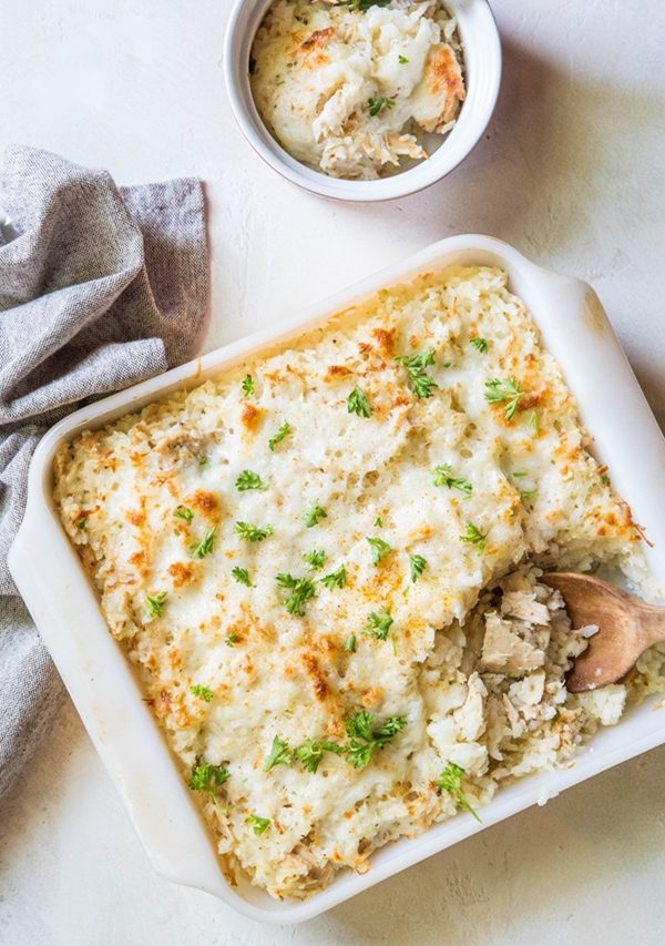 Casserole dish and small ramekin of tuna rice casserole.