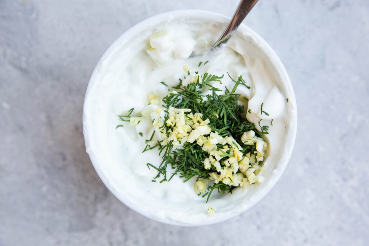 Tzatziki sauce ingredients in a small bowl ready to be mixed up.