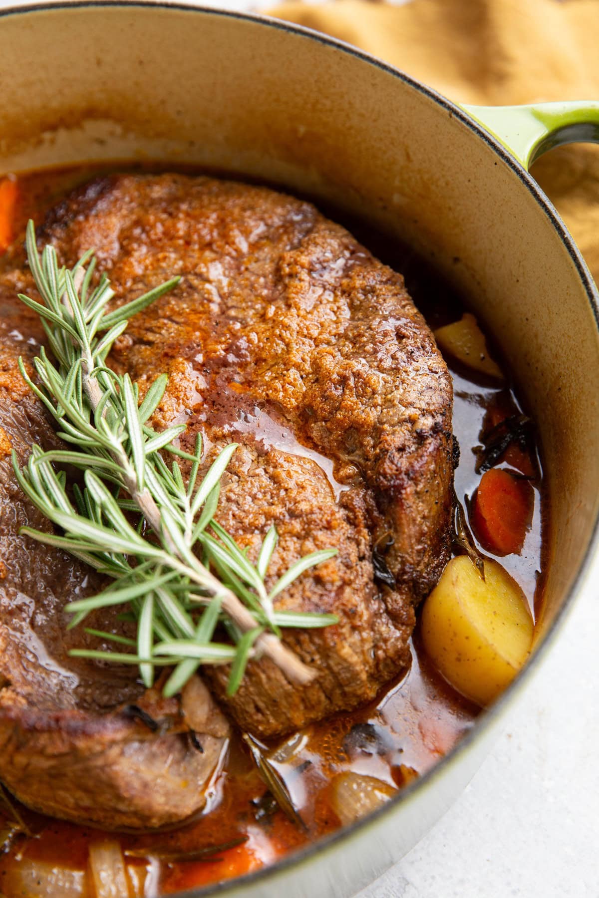 Dutch oven pot roast with vegetables, fresh out of the oven and ready to serve.