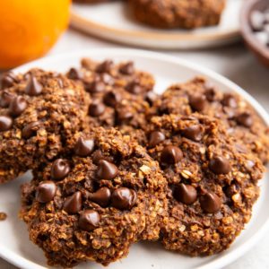 Large white plate of chocolate pumpkin cookies.