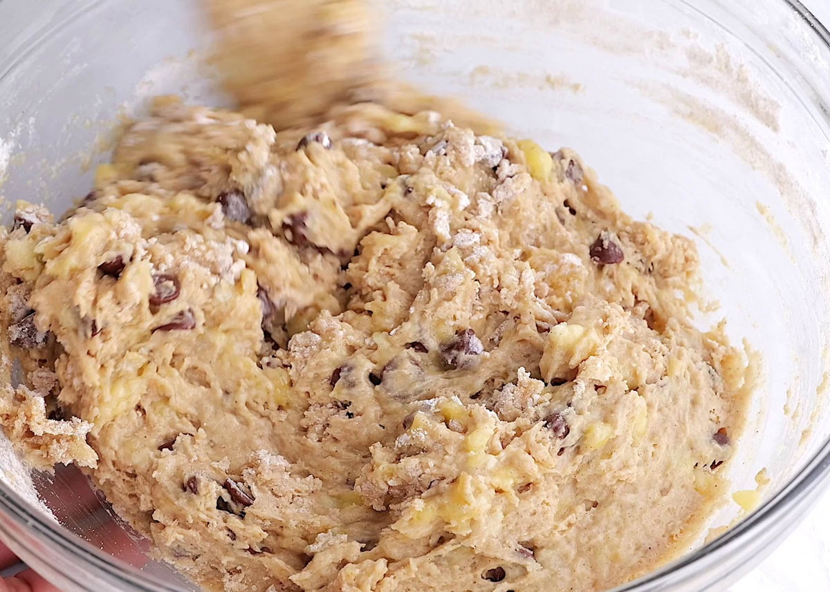 Banana muffin batter in a large mixing bowl.