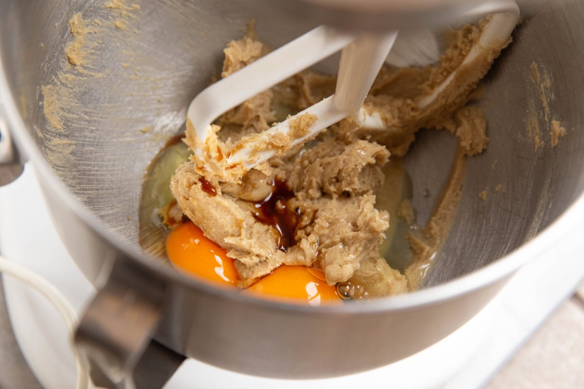 Butter, sugar, and eggs in a stand mixer to make coffee cake.