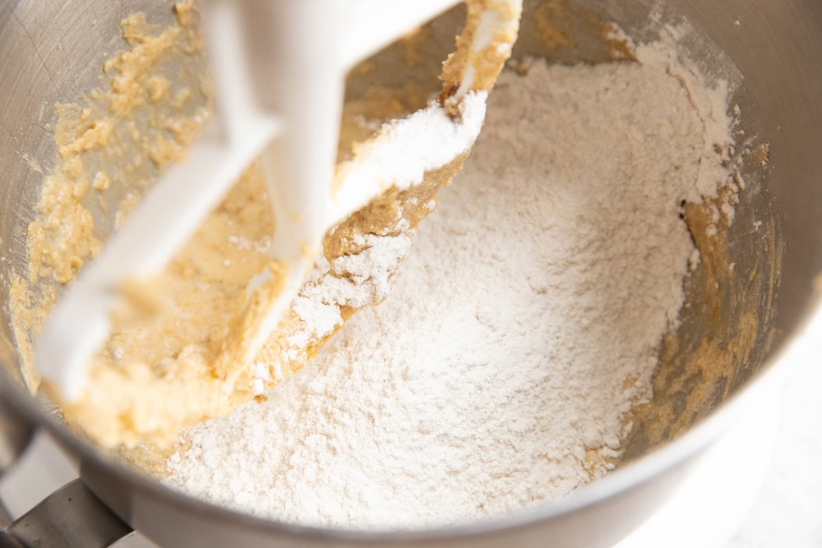 Butter, sugar, eggs, and flour in a stand mixer to make coffee cake.