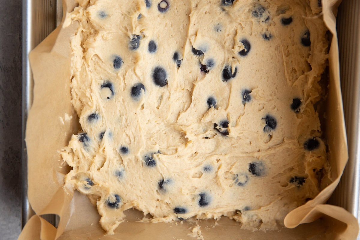 Yogurt coffee cake batter in a cake pan, ready to go into the oven.