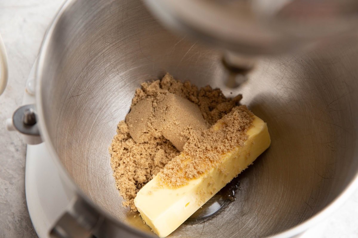 Butter and sugar in a mixing bowl to be creamed together.