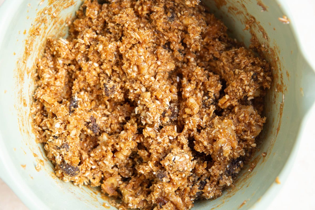 Peanut butter oatmeal raisin cookie dough in a mixing bowl.