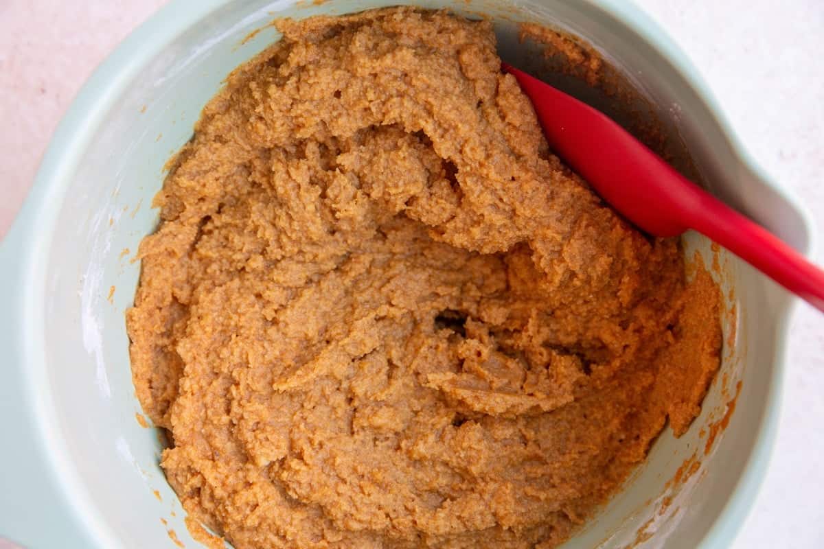 Pumpkin bread batter in a mixing bowl.