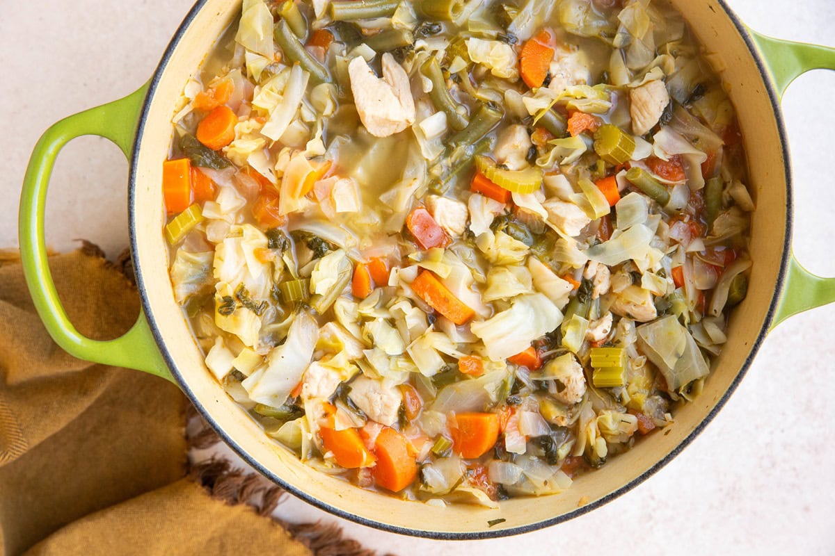 Large pot of chicken cabbage soup, freshly made and ready to eat.