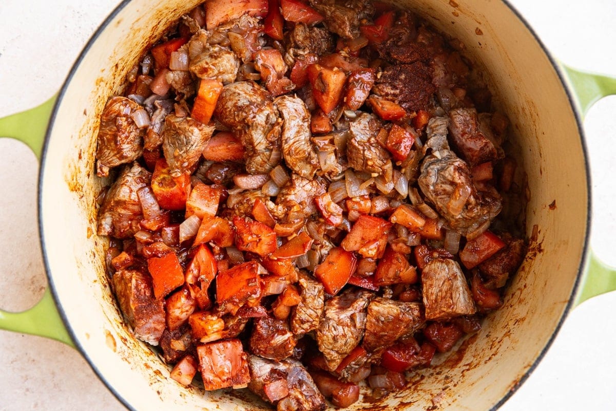 Bell peppers, onion, beef, and paprika in a large pot.