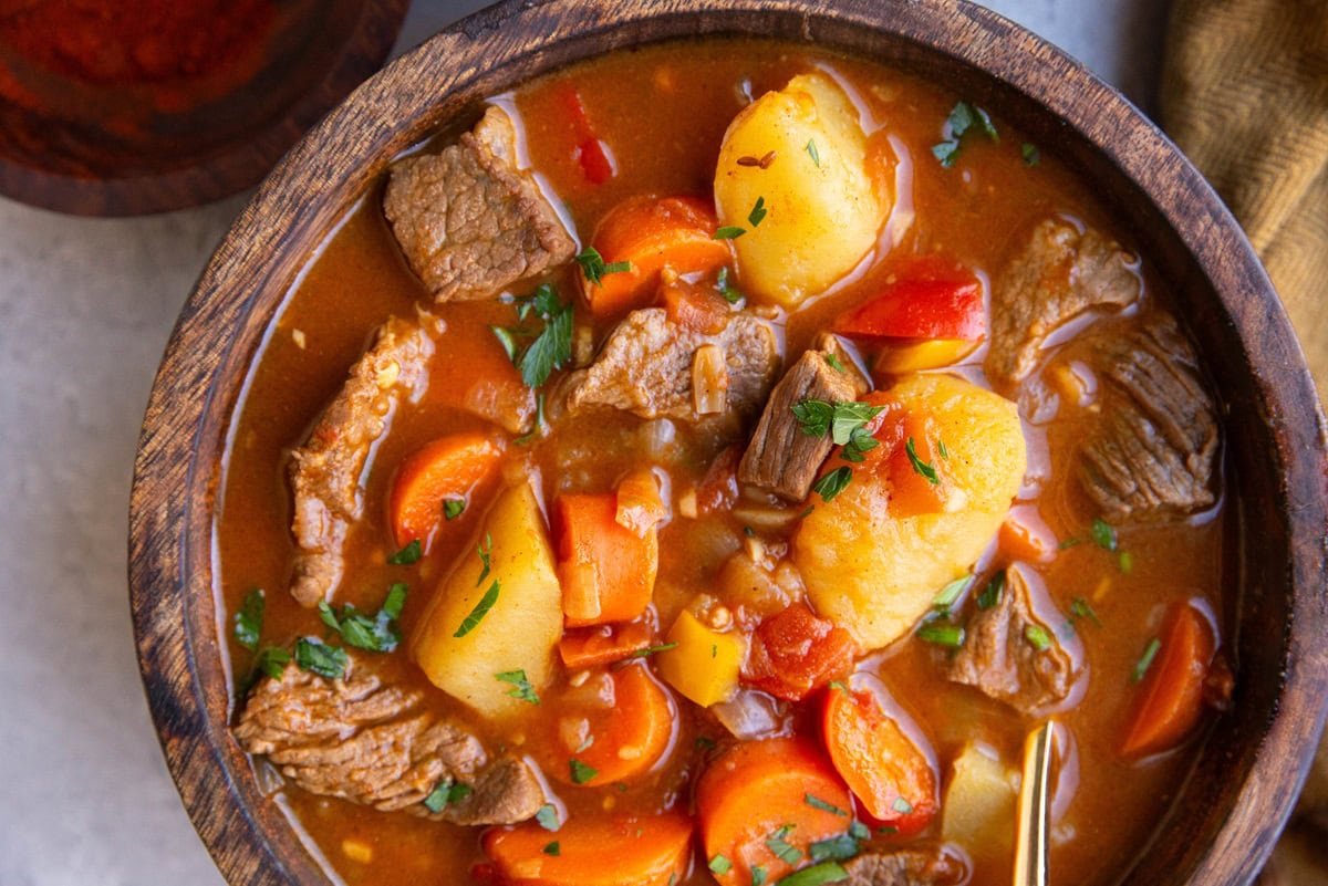 Big wooden bowl of beef stew