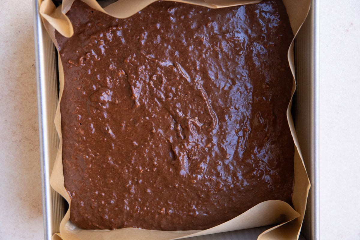 Baking pan with brownie batter ready to go into the oven.