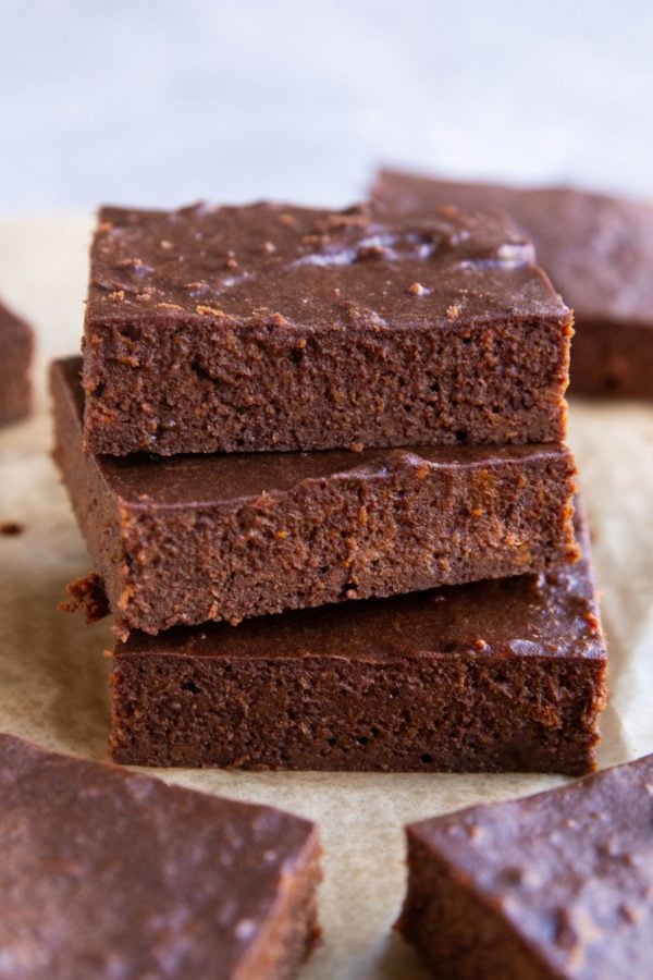 Stack of three protein brownies with other brownies to the side