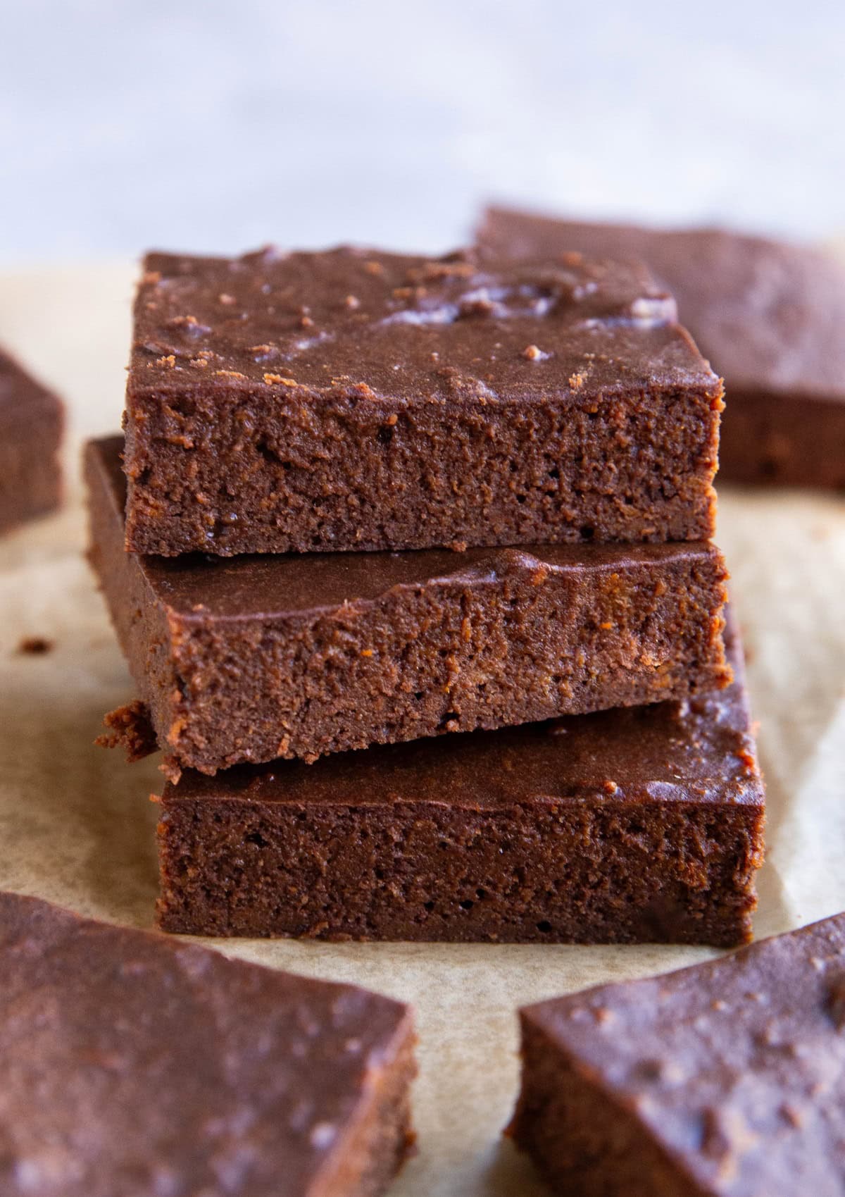 Stack of three protein brownies with other brownies to the side