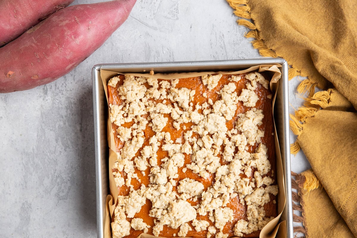 Square baking dish full of sweet potato bars, fresh out of the oven.