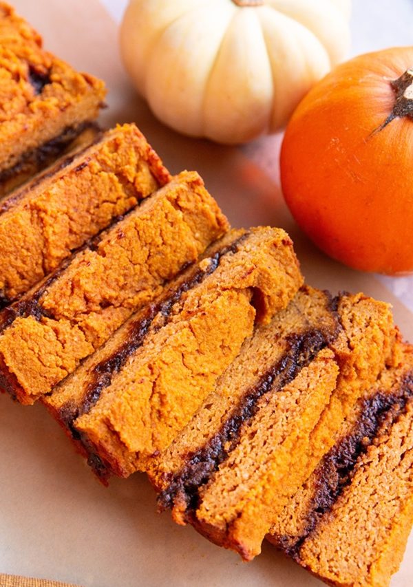 loaf of cinnamon swirl pumpkin bread cut into slices