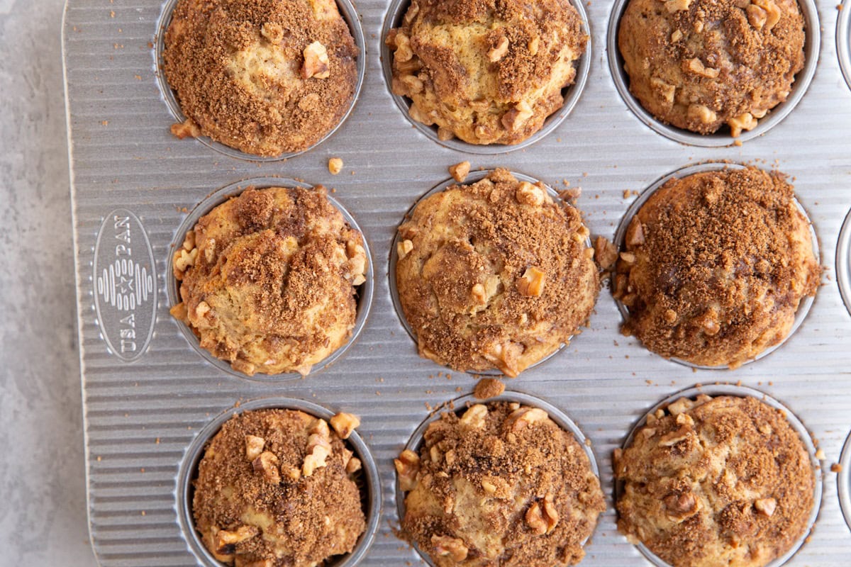 Muffin tray with baked muffins inside, ready to eat.