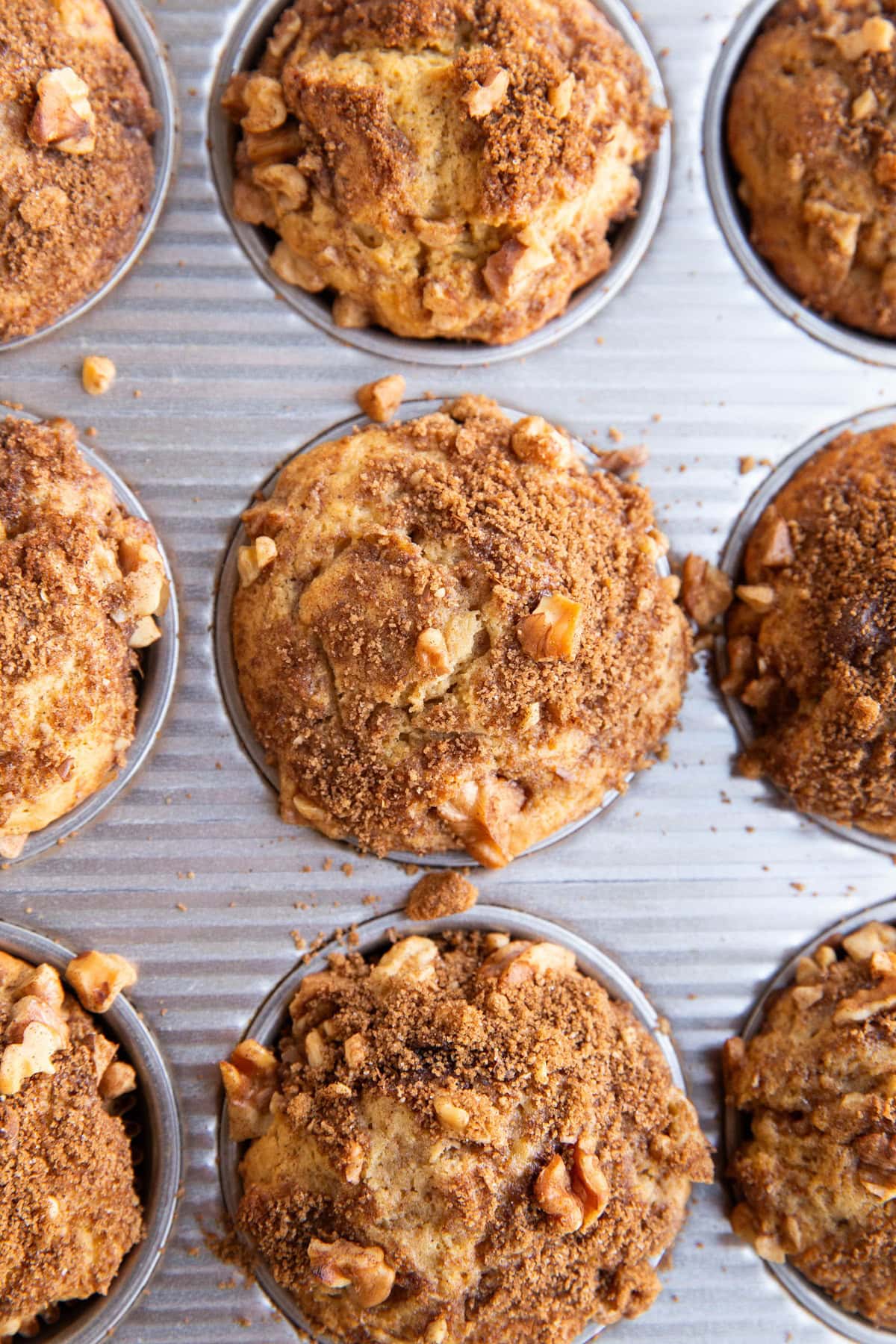 Muffin tin fresh out of the oven with coffee cake muffins, ready to eat.