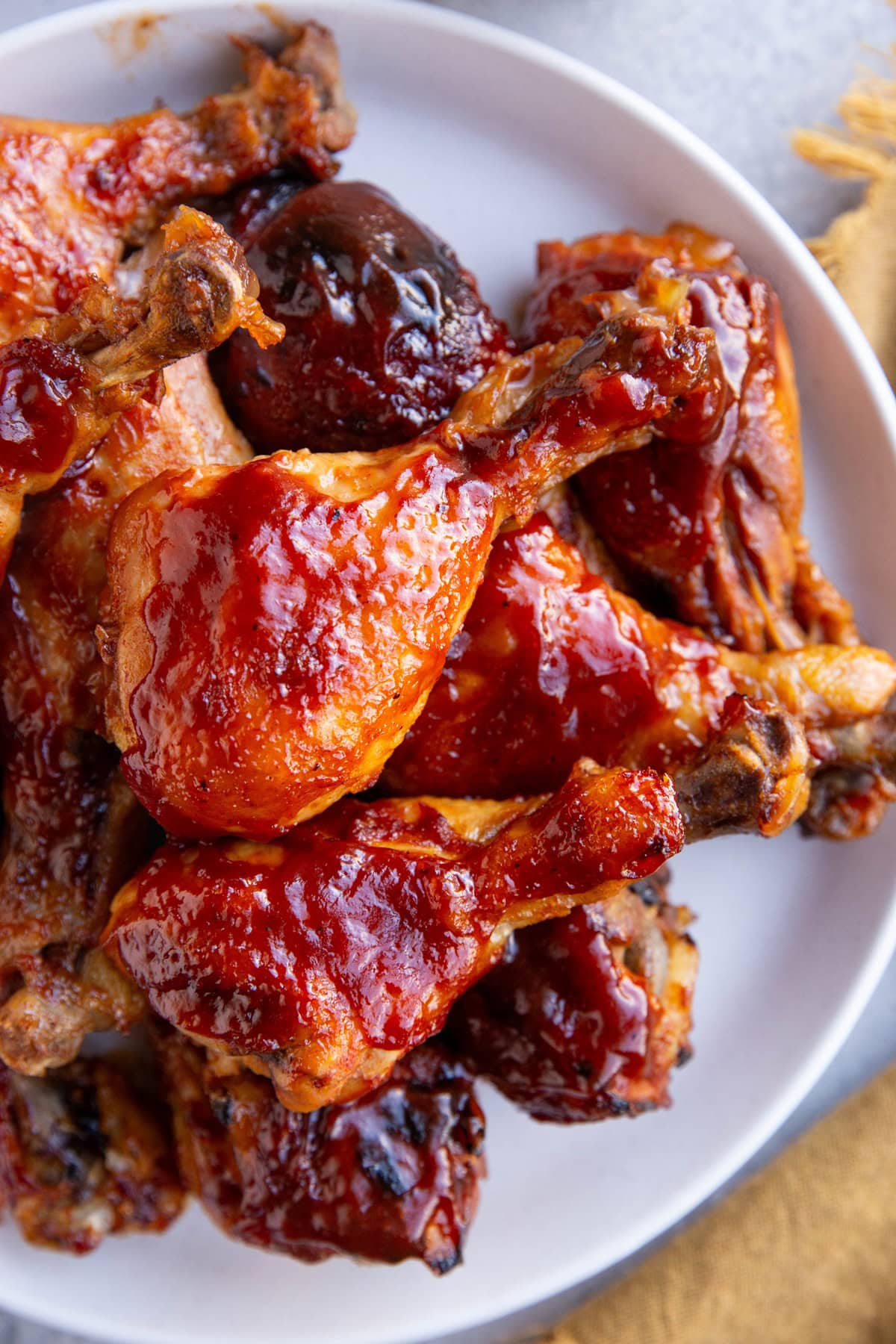 Slow Cooker BBQ Chicken Drumsticks on a plate, ready to serve.