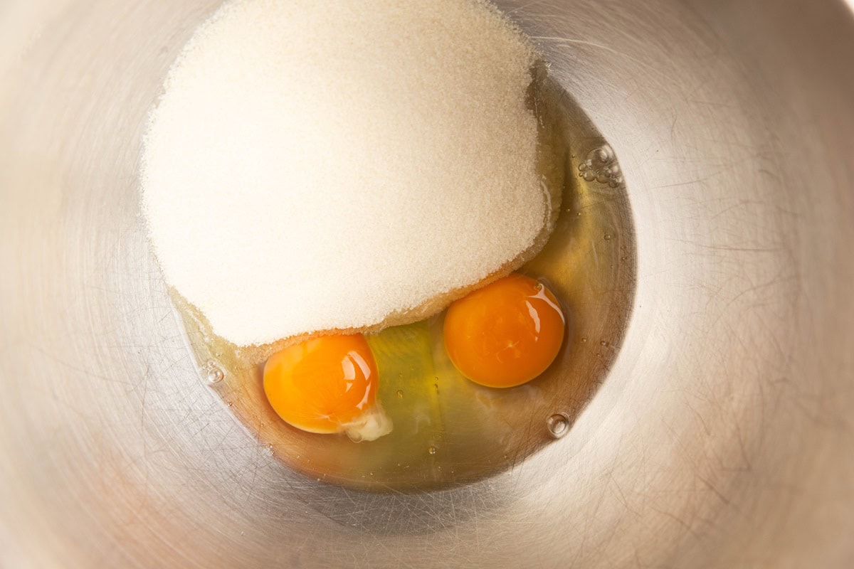 Stand mixer with sugar and eggs.