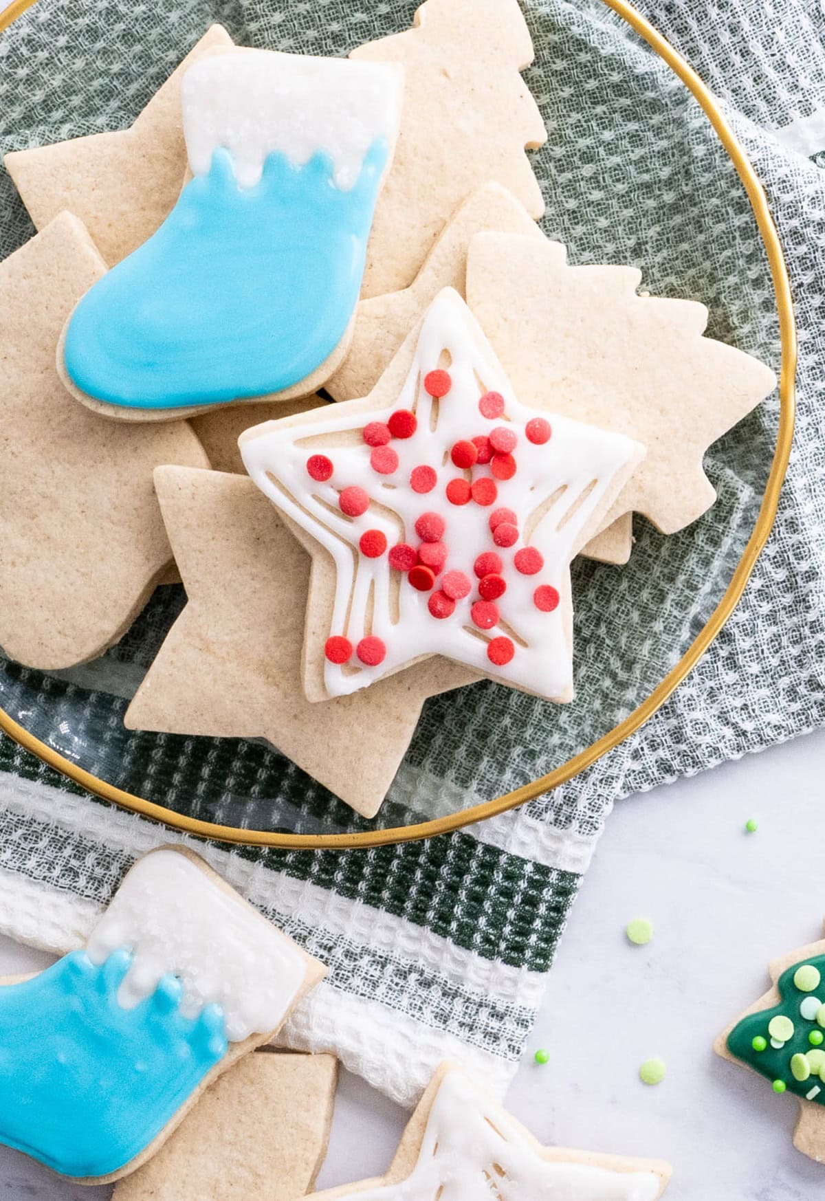 Plate of sugar cookies with a stocking and a star.