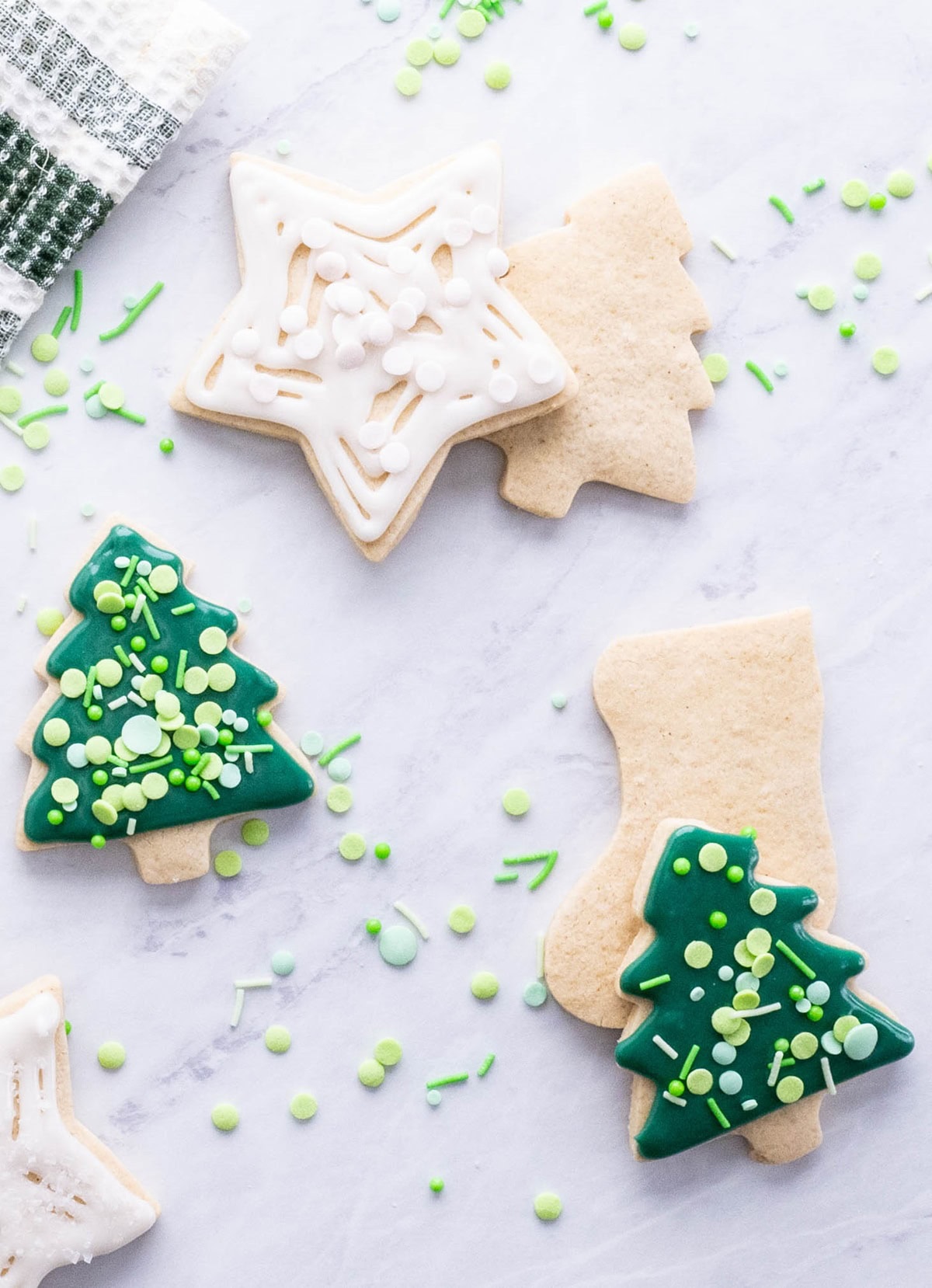 Christmas cookies on a marble surface.