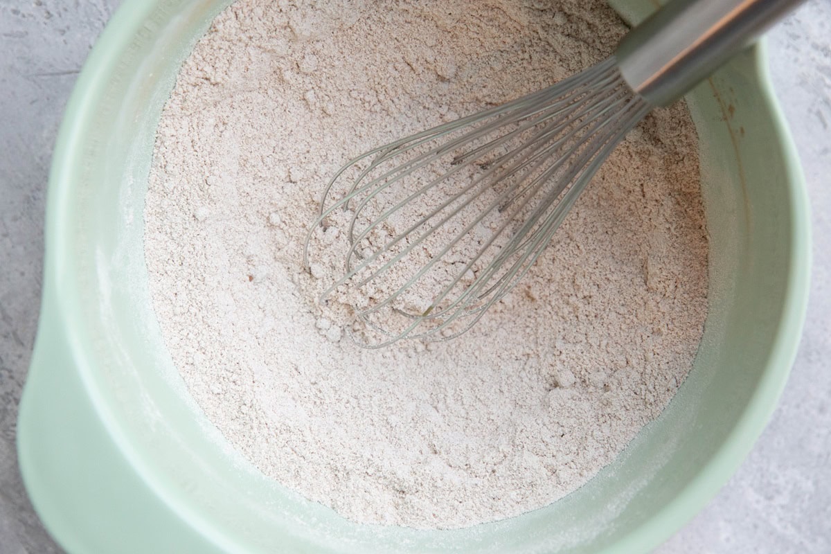 Dry ingredients for pumpkin cake mixed up in a mixing bowl.