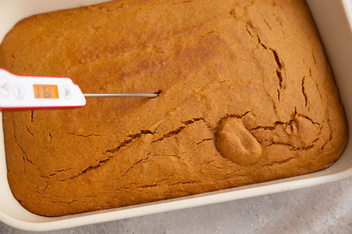 Thermometer in the center of pumpkin cake to check the internal temp.